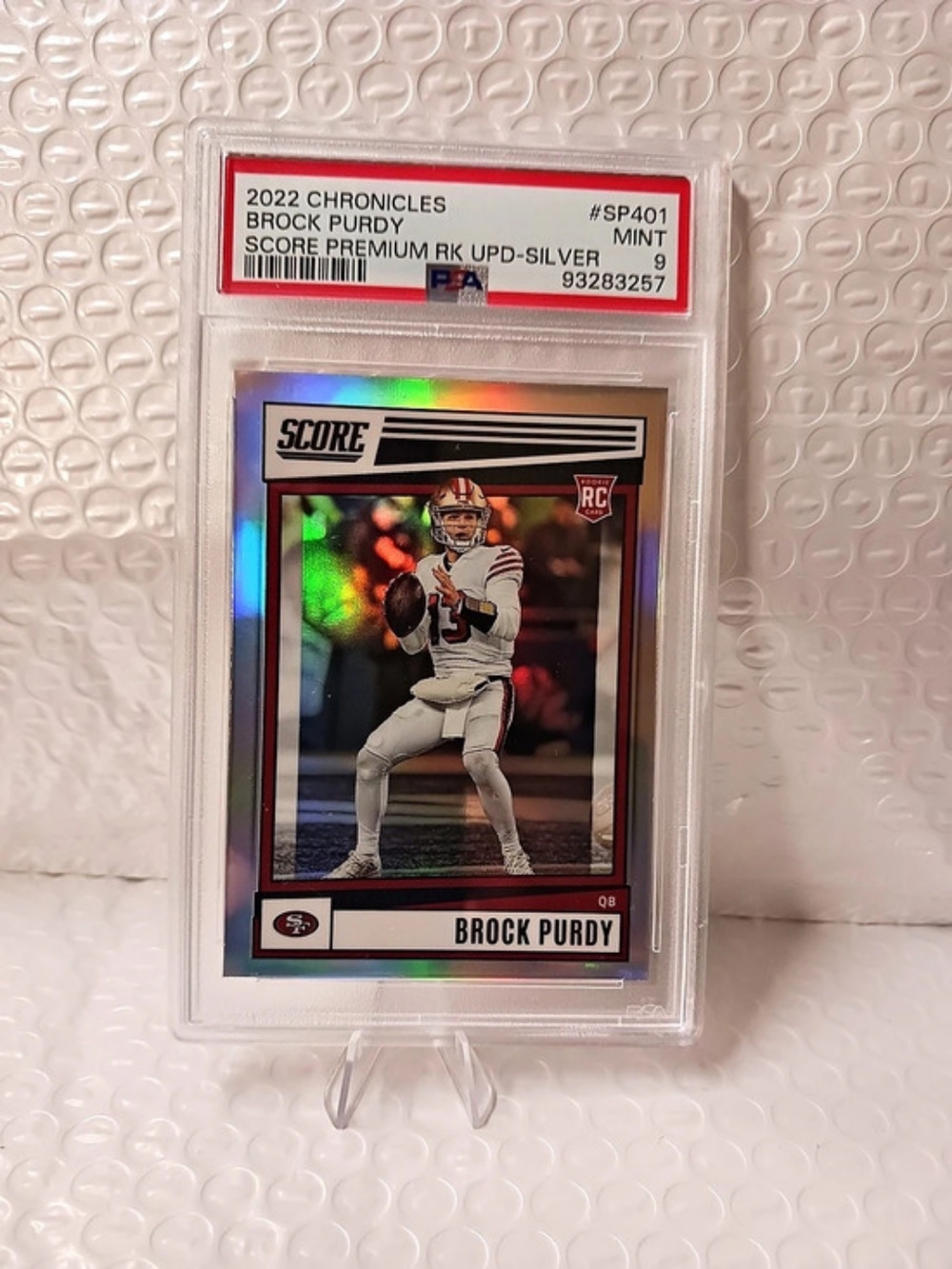 Score 2022 Chronicles Score Premium RC Upd-Silver Brock Purdy RC Silver PSA 9